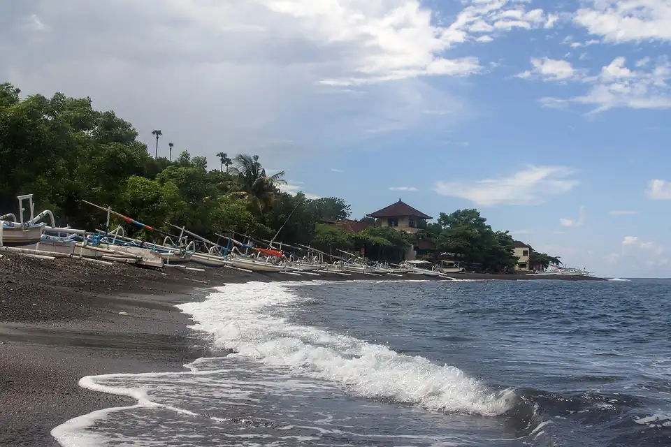 Amed's shoreline curving below the hills