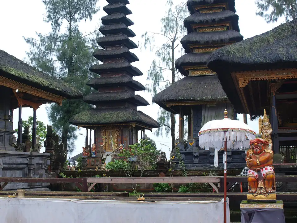 Tiered shrines and a ceremonial umbrella at the temple