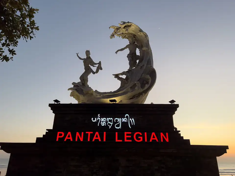 The Pantai Legian sign and statue