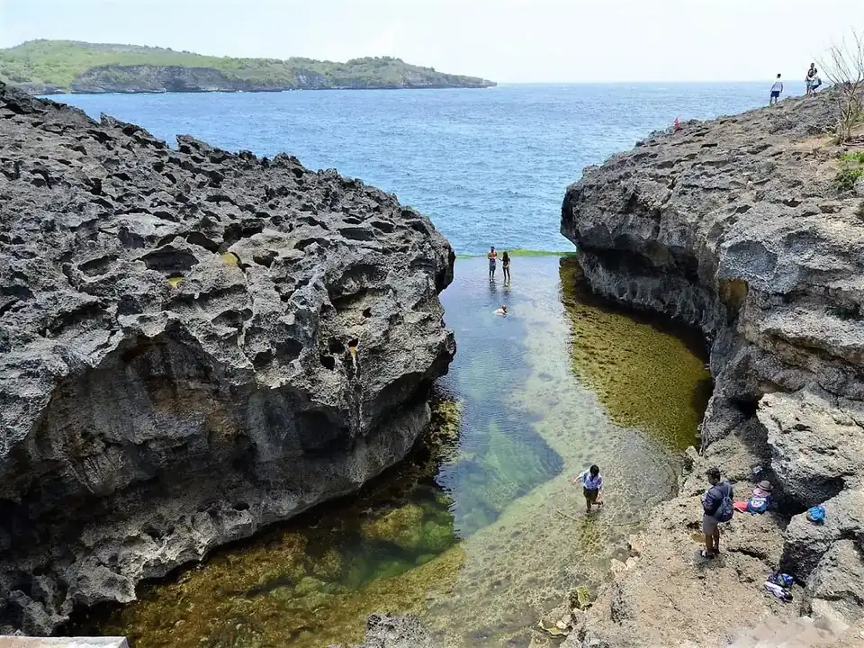 Visitors on the rock shelf above Angel's Billabong