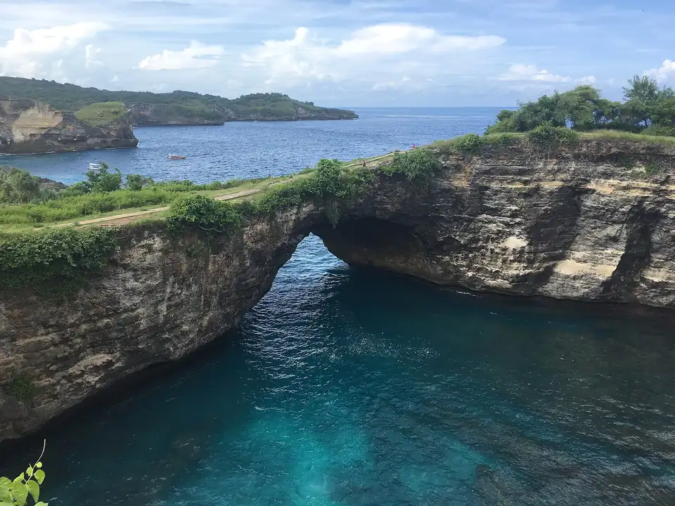 The arch at Broken Beach from the cliff path