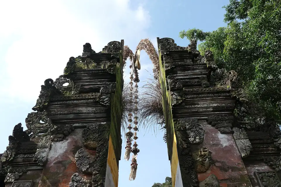 A penjor over the split gate at Tirta Empul