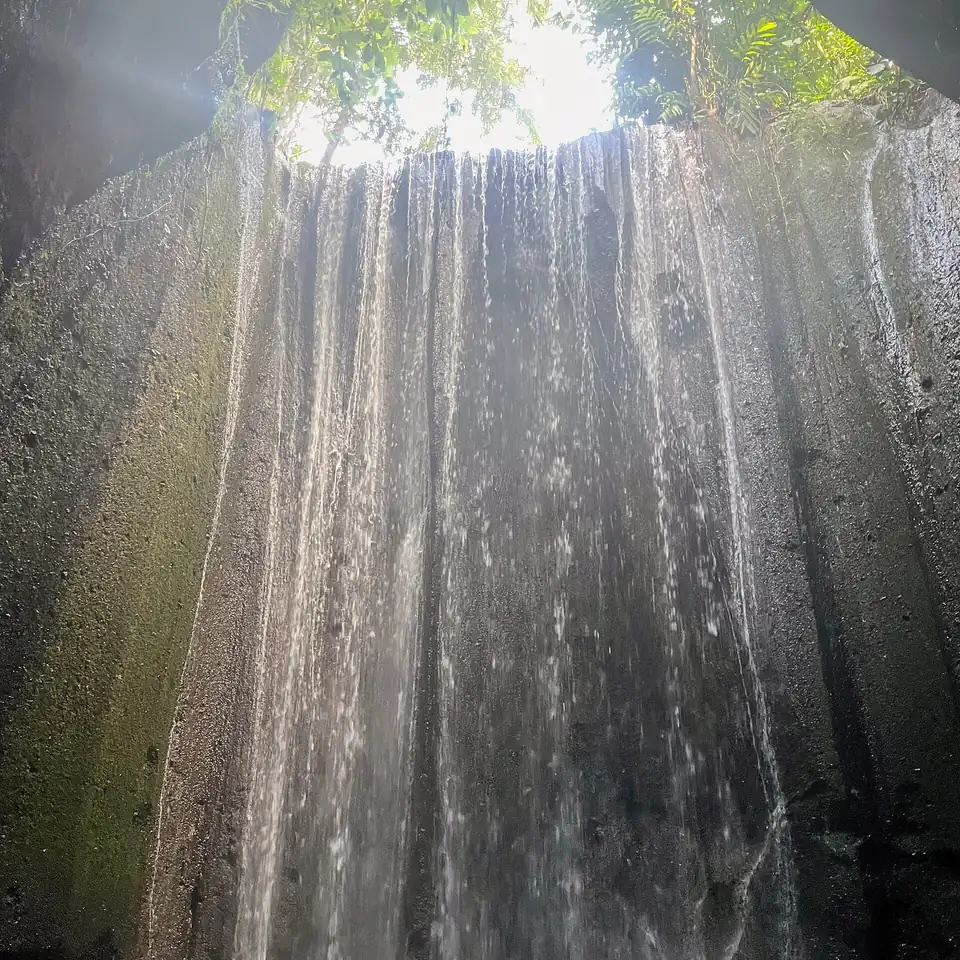 Light falling through the opening above Tukad Cepung waterfall