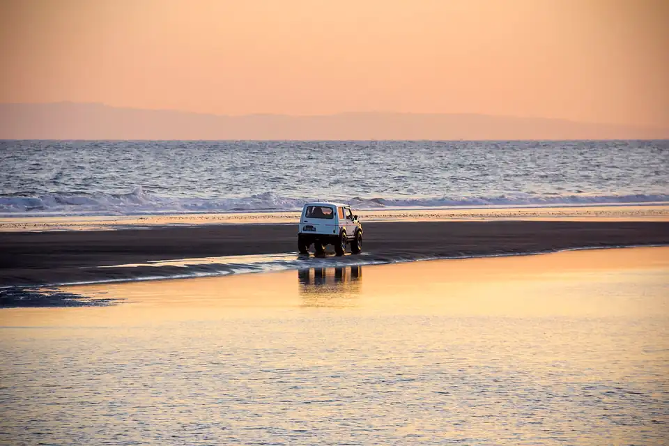 A jeep on the black-sand beach at Yehembang in west Bali