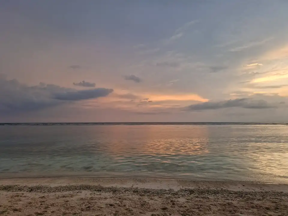 Sunset colour over the reef and the flat water off a Gili beach