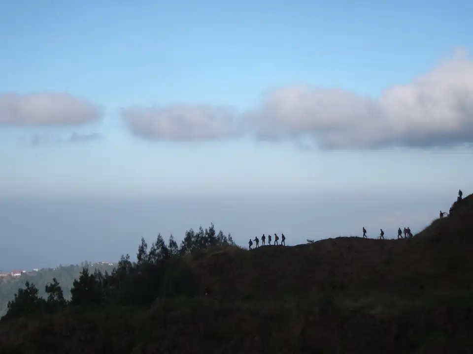 Walkers on the rim of Mount Batur on the way down after sunrise