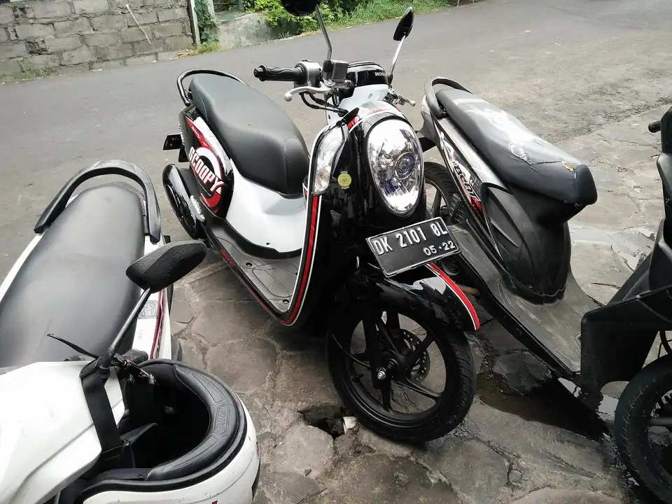 A Honda Scoopy automatic scooter parked in Jimbaran