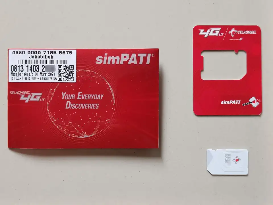A Telkomsel simPATI SIM card pack, opened