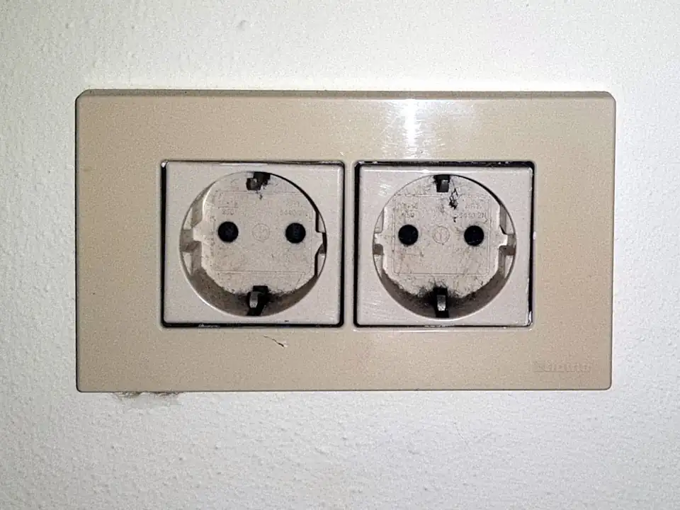 A pair of Type F (Schuko) wall sockets, the standard Bali uses; photographed in Europe