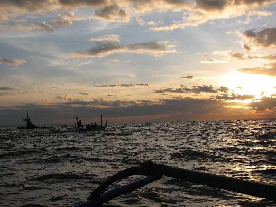 Boats on a sunrise dolphin trip off Lovina