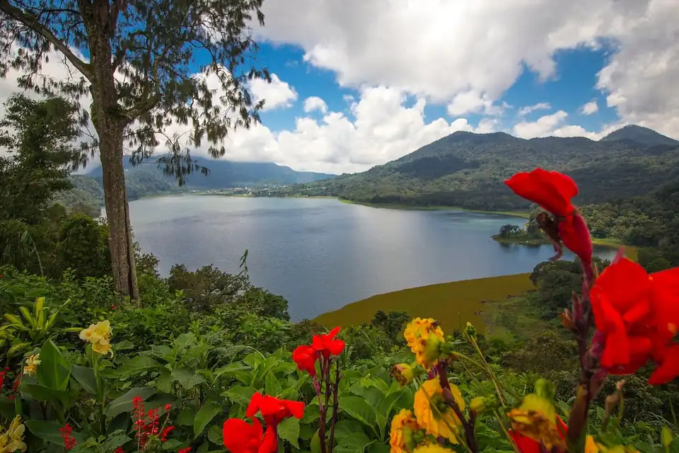 Lake Buyan ringed by forest under highland cloud