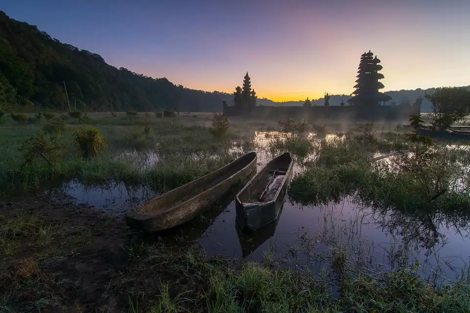 Dugout canoes on Lake Tamblingan at sunrise
