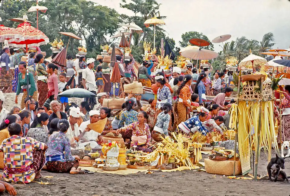 Offerings and worshippers at a ceremony in Sanur in 1971