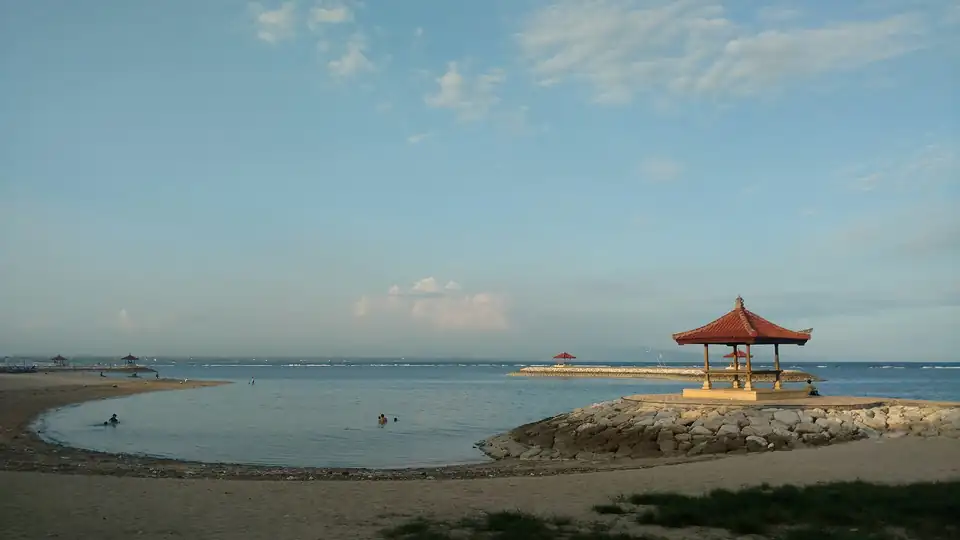 A beach pavilion at Sanur at low tide