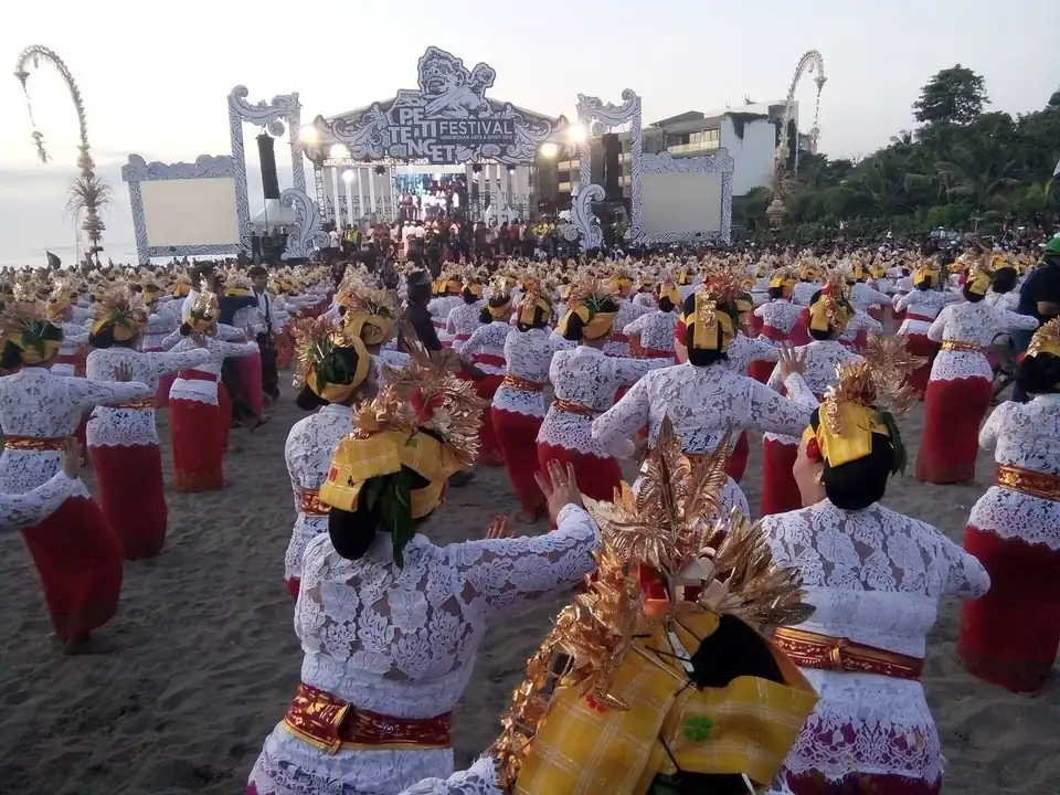 Dancers in gold headdresses at the Petitenget beach festival