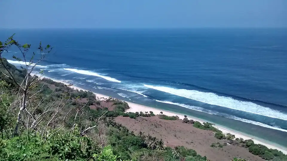Surf breaking along the Bukit coast at Pecatu
