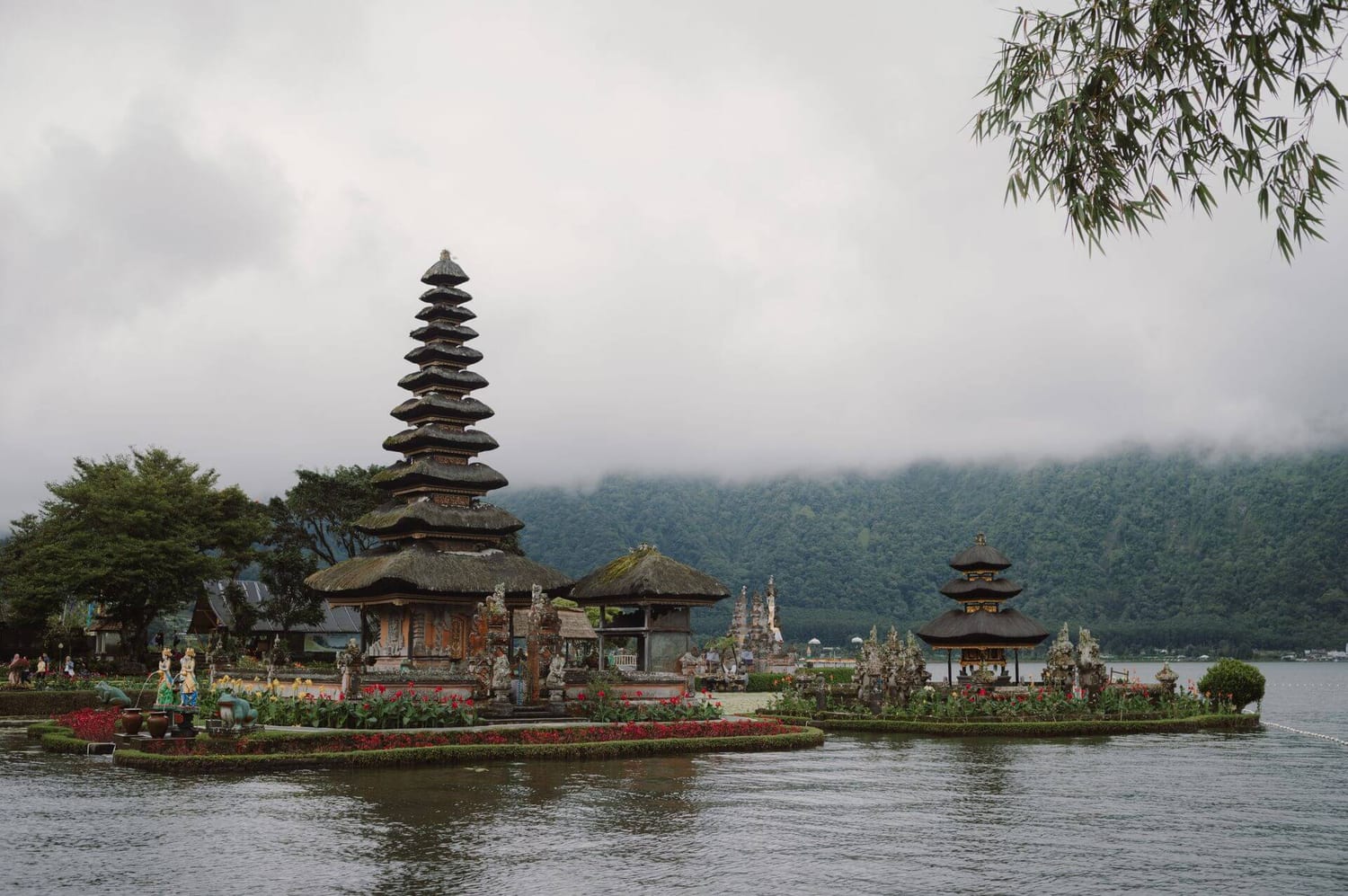 The merus of Pura Ulun Danu Bratan on the garden island in Lake Bratan, with the misty Bedugul hills behind